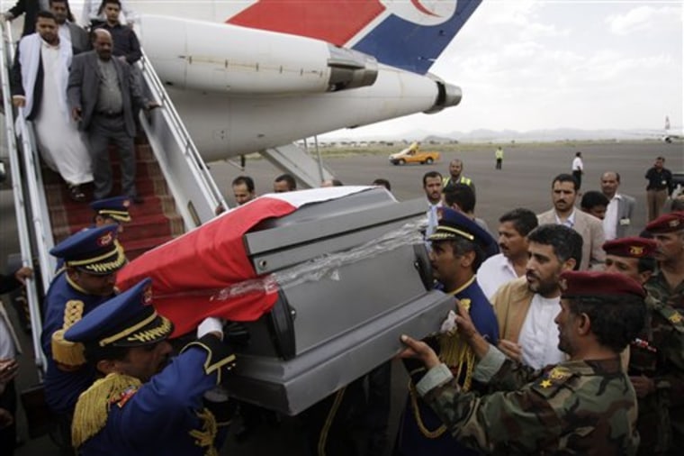 Yemeni honor guards Tuesday carry the coffin of Chairman of the Shura Council Abdul Aziz Abdul Ghani, who died of injuries sustained in the June 3 attack on Yemeni President Ali Abdullah Saleh's compound, in Sanaa, Yemen.